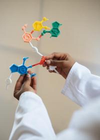 man holding genetic puzzle